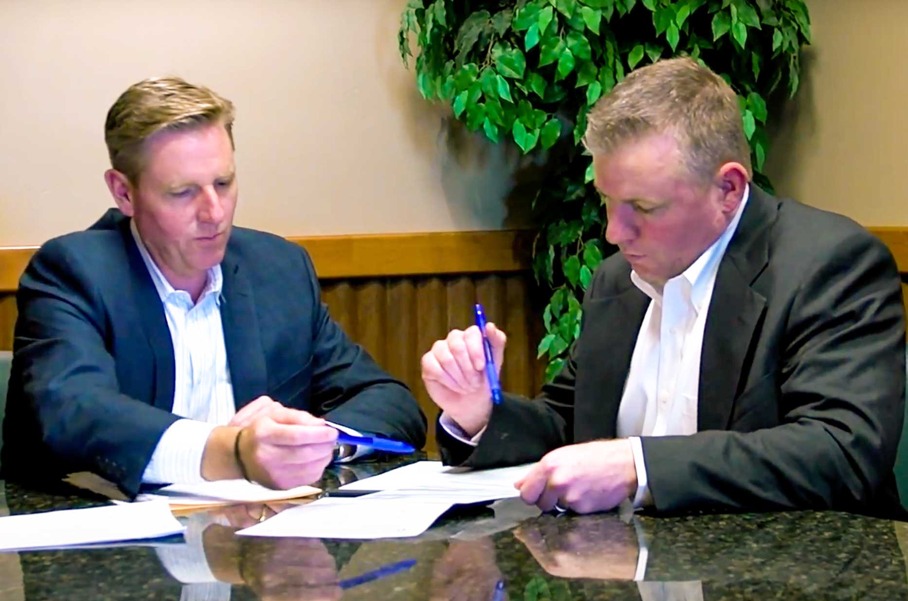 Thomas and Eddie Knoell collaborating on mortgage solutions at Mortgage Brothers LLC